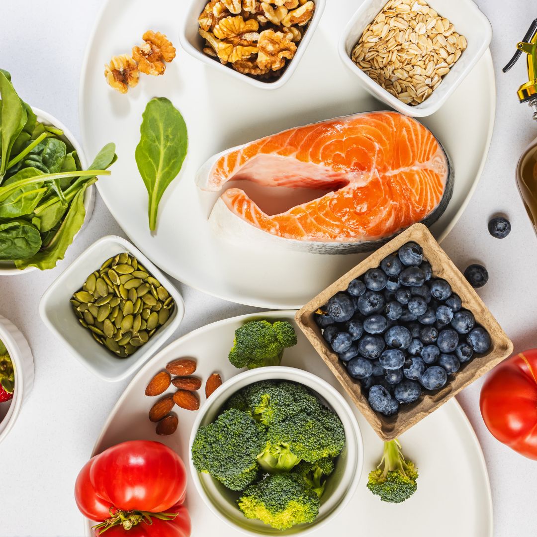 Nutrient-rich foods including eggs, salmon, Brazil nuts and leafy greens supporting thyroid health